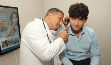 Medical Provider Evaluating Patient in Urgent Care Center For Immigration Medical Exam