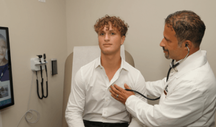 Providing Care to a Walk-In Patient at an Urgent Care Clinic Offering Physicals For School and Sports